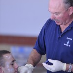 Role player having simulated injuries applied for an active shooter exercise.